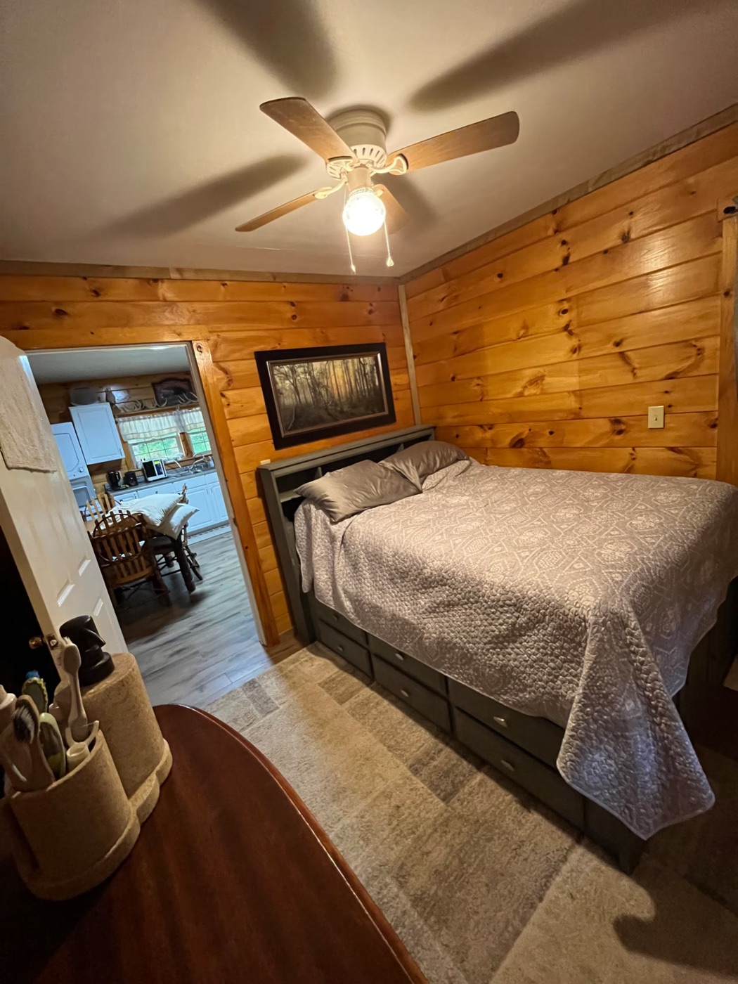 Cozy wood-paneled bedroom