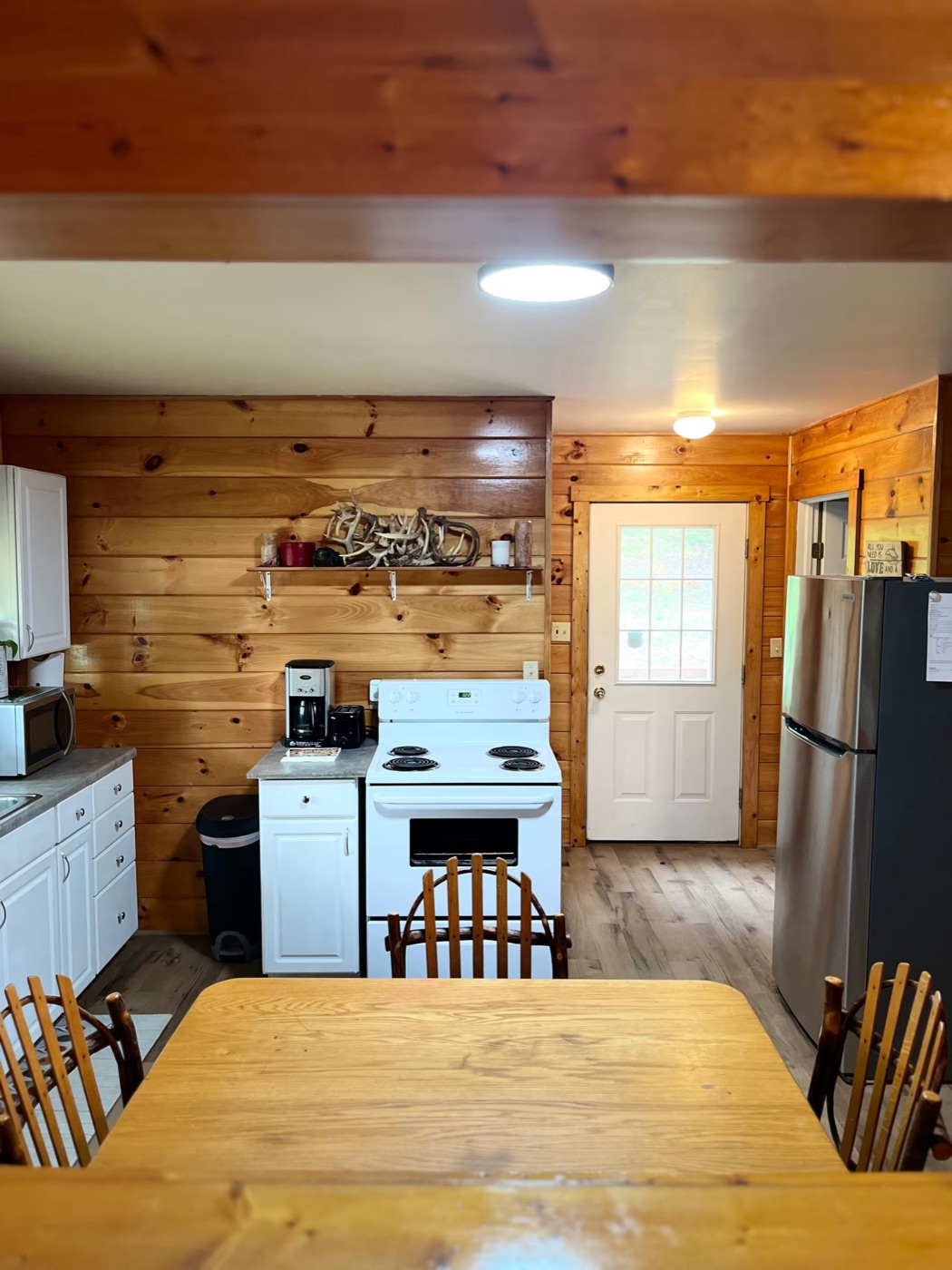 Kitchen with stove and refrigerator