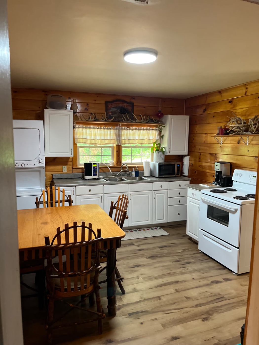 Full kitchen with wood dining table