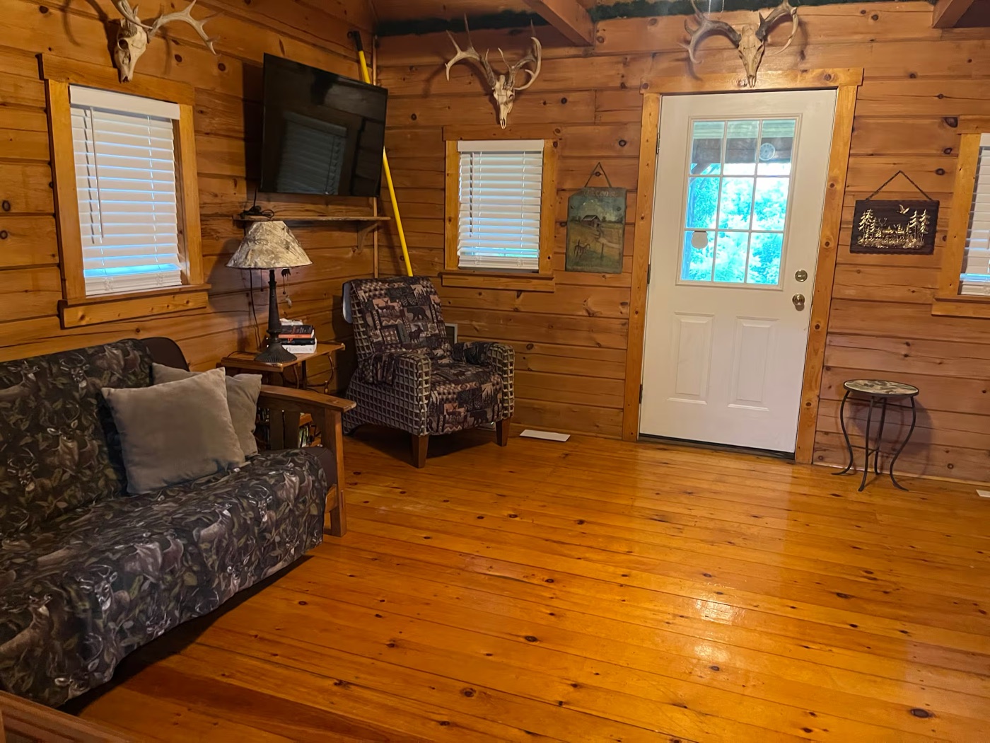 Rustic living room at Cozy Creekside Cabin